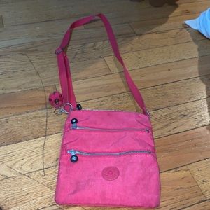 This is a pink bag. Brand is Kipling